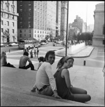 [Couple sitting on steps to the Met.]