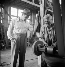Circus [Two men looking at a machine.]