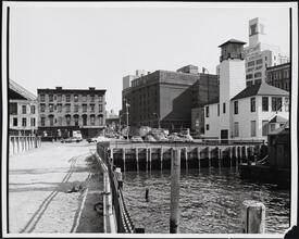 [Looking east toward the corner of Old Fulton and Water Streets from the edge of the East River.]