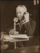 [Al Smith on the telephone.]