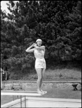 Billy Rose [Eleanor Holm putting on a swimming cap.]