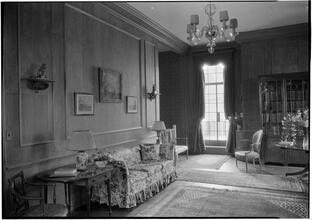 F. Cecil Baker [residence]. Living room to sofa and staircase.