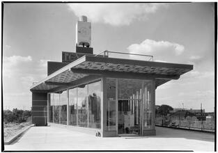 Rex Cole [Building]. Closeup of show windows and entrance doors.