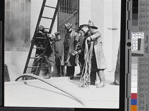 [Firemen doing training exercises.]