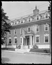 [Brick building with American Flag.]
