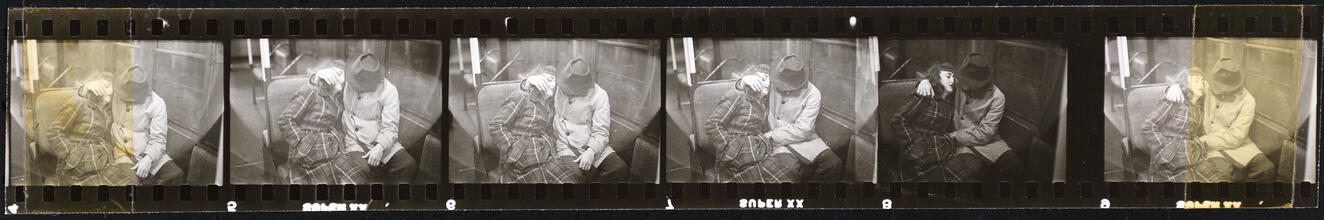 Life and Love on the New York City Subway [Couple on a subway.]
