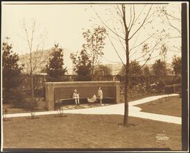 [Hawthorne Court. Apartment entrance and garden with children.]