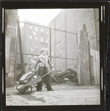 Shoe Shine Boy [Mickey carrying equipment in a wheelbarrow.]