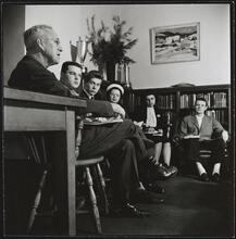 Columbia University [Professor with students in an office.]