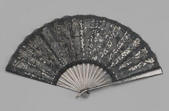 Folding fan of black silk leaf with applied silver spangles