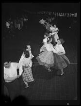 74th Street and Madison Avenue. Folk dancing at roof party at Madison Avenue Presbyterian Church House.