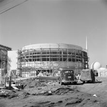 [Construction of the New York World's Fair site, with the Trylon and Perisphere in the background.]