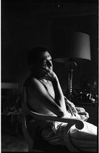 Peter Arno [Arno sitting in a chair.]