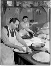 [Men baking.]