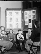 [Children learning about Native American history.]