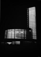 [Glass Inc. building at night, New York World's Fair.]