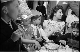Deaf Children [Children eating cake at a party.]