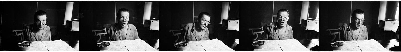 Peter Arno [Arno reading sheet music.]