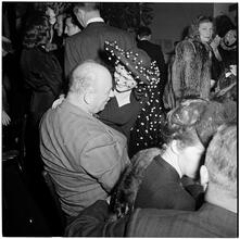 Champagne Cholly Book Party [Woman and man talking.]