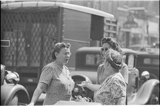 Street Conversations [Three women talking on the street.]
