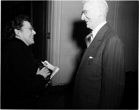Dale Carnegie [Dale Carnegie talking with a woman.]