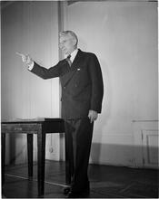 Dale Carnegie [Dale Carnegie teaching a class on public speaking.]