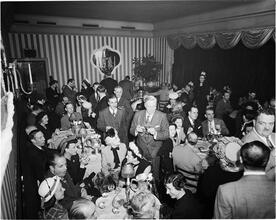 Champagne Cholly Book Party [People socializing at a party.]