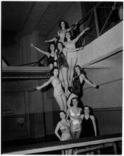 Holm, Eleanor- World's Fair N.Y. Swimming Pool [Eleanor Holm posing with her students.]