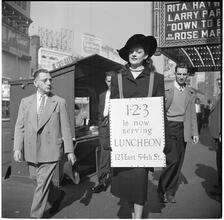 Advertising Sandwich Board [Woman wearing a sandwich board advertising the 1-2-3 cafe.]