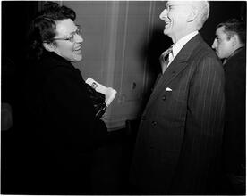 Dale Carnegie [Dale Carnegie talking to a woman.]