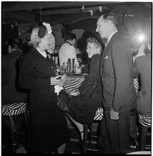 Champagne Cholly Book Party [People talking at the bar.]
