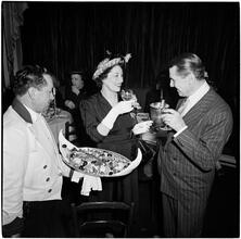 Champagne Cholly Book Party [Man and woman talking.]