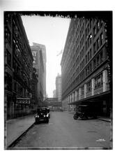 View looking east through 33rd Street, showing Gimbels & Saks stores.