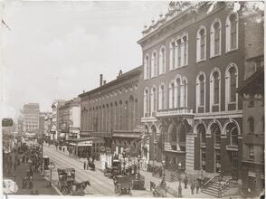 [Busy streetscape of East 14th Street.]