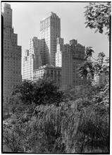Barbizon Plaza Hotel. Exterior from Central Park over trees.
