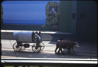 [Actors in Conestoga wagons during the Parade of Railroads show.]