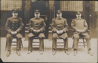 [Group portrait of firemen, including Ed Worth, Chief of 3rd Battalion.]