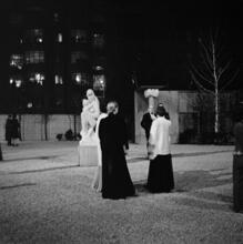 [MoMA sculpture garden at night.]