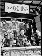 [Man at altar.]
