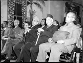 [Men in an audience.]