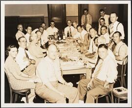 For 34 Years of Loyal Service - Eric S. Barron [Eric Barron with a group at a meal.]