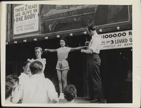 [Sideshow performers on Coney Island midway.]