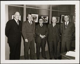 For 34 Years of Loyal Service - Eric S. Barron [Eric Barron with four other men.]