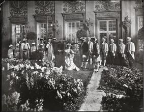 [Hyde Ball, Madame Rejane and Large Group in Garden of Versailles.]
