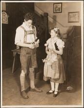 [Francis Lederer as The Gentleman in Gay Braces and Eleanor Hausman as The Crocus-Gatherer in "Autumn Crocus".]