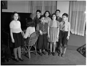 [Children singing.]