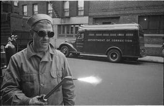 Paddy Wagon [Man with welding equipment used in the making of the television show Paddy Wagon.]