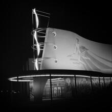 [Night view of the Production and Distribution building, New York World's Fair.]