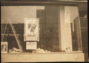 Street Scenes, etc. Showing Displays of Liberty Loan Posters during World War I [Liberty Loan poster in a window.]
