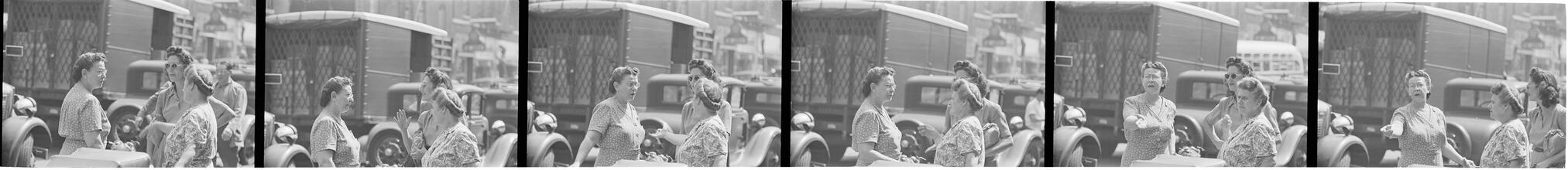 Street Conversations [Three women talking on the street.]